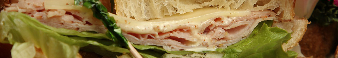 Eating Deli Sandwich at The Upper Crust Sandwich Shoppe restaurant in Riverside, CA.